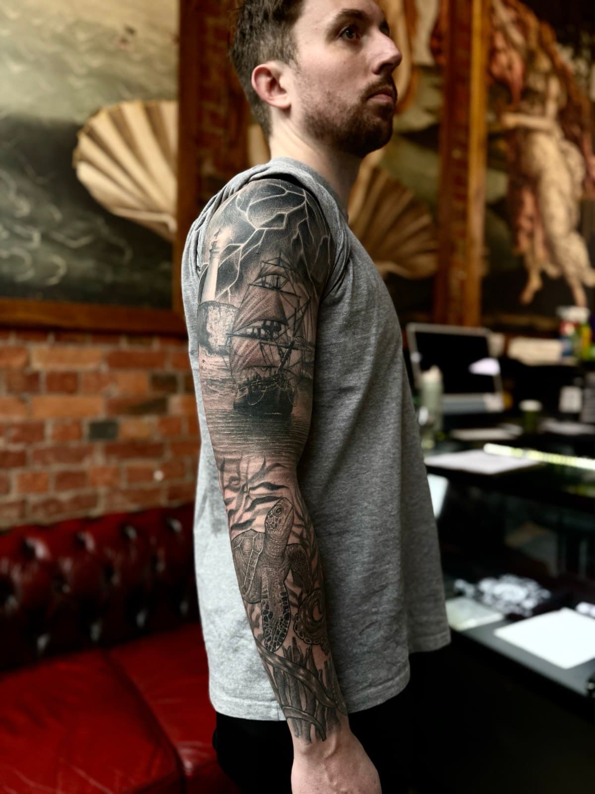 Nautical black and grey sleeve with ship, lighthouse, and sea turtle by Tobias Meredith
